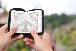 quran book hands holding quran